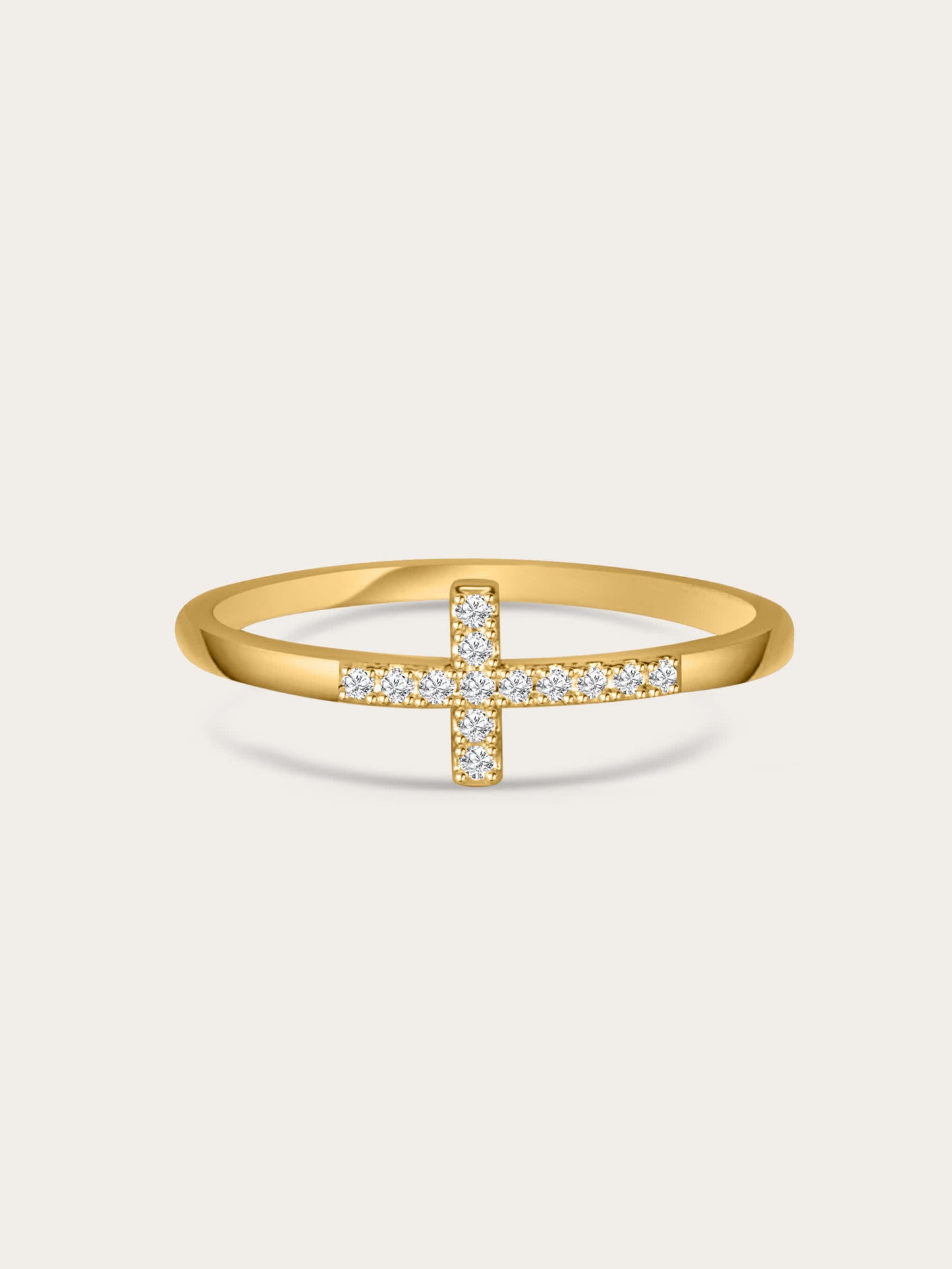 Front-facing image of the Anointed Radiance gold cross ring with pavé cubic zirconia set in a slim 18K gold-plated band