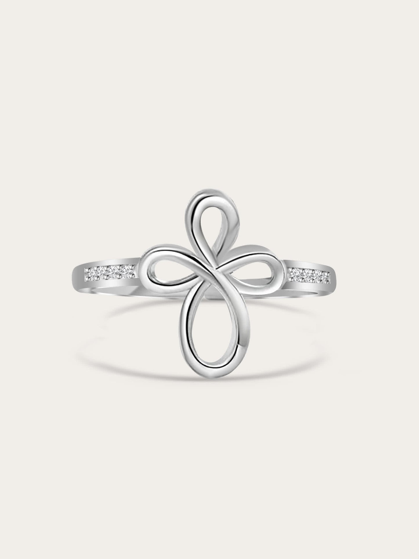 Front-facing studio shot of Covenant Bloom Silver Cross Ring showing heart-shaped petal cross design with white zircons on a neutral background