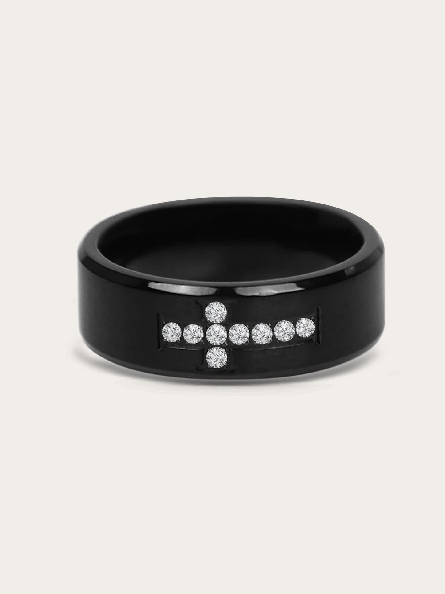Front-facing product image of Creed Noir Black Cross Ring on white background, showcasing the pavé crystal cross design centered on a black polished band.