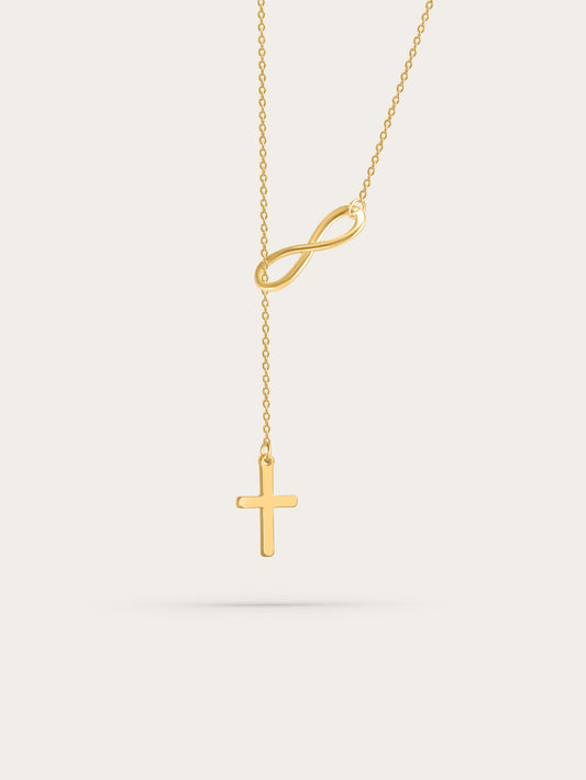 Front-facing product image of the gold-tone infinity and cross necklace on a white background, showing the pendant's elegant drop design