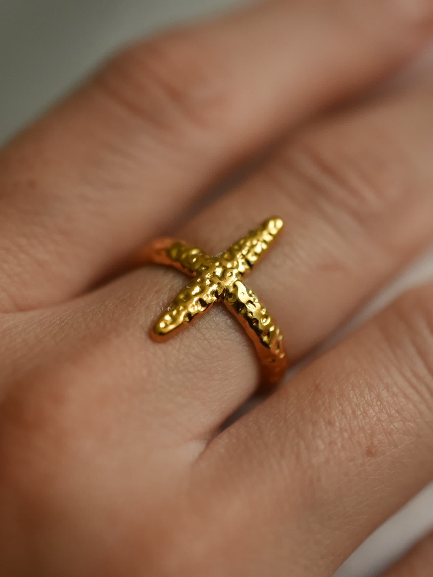 Glory Forged Cross Ring worn on hand, showing textured detail