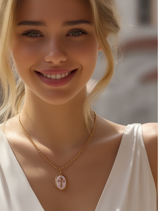 Model wearing necklace with white outfit
Woman smiling while wearing Sacred Light Enamel Cross Necklace with white top