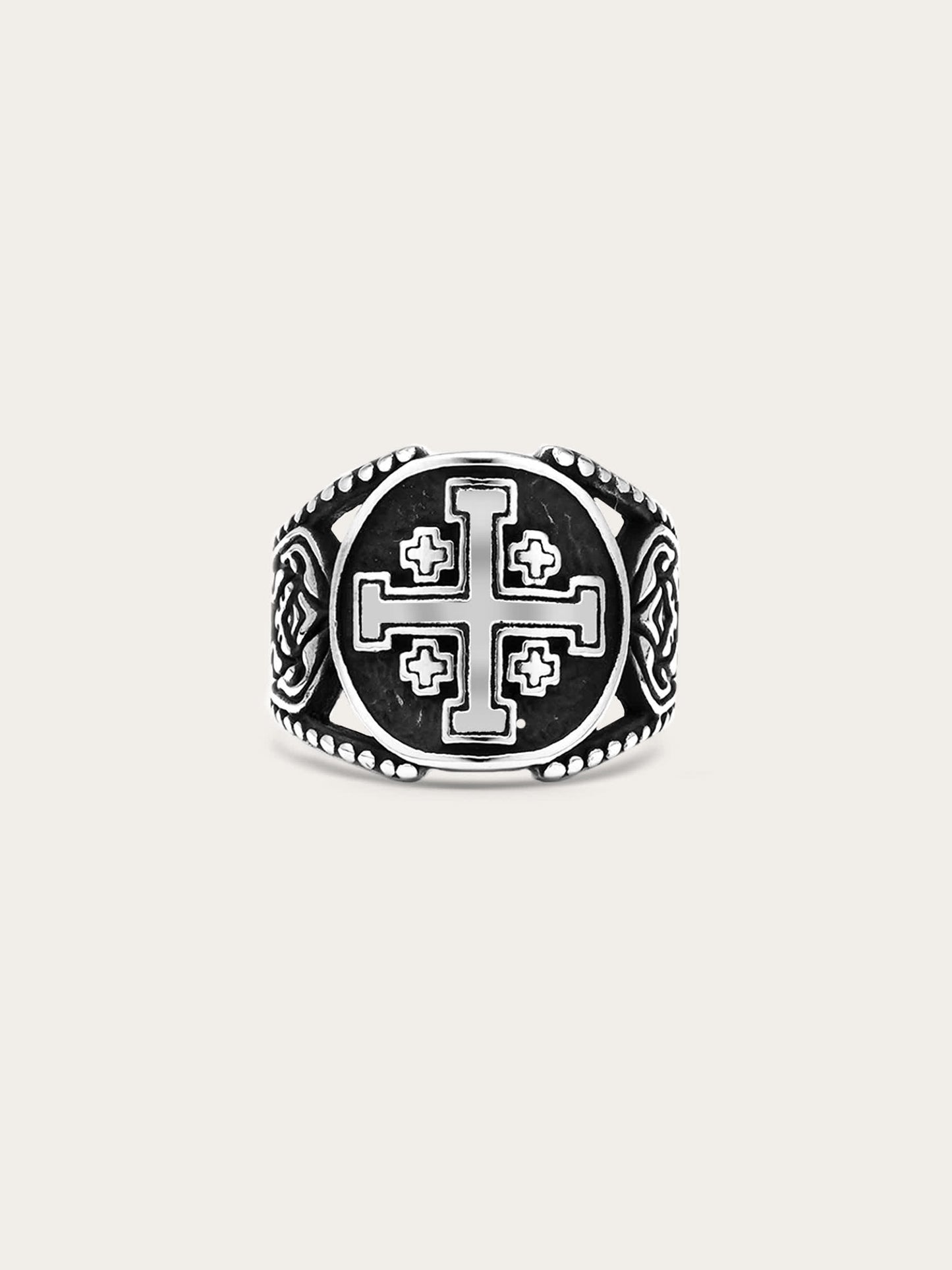 Front-facing image of a titanium steel Jerusalem cross ring with engraved medieval symbols and antiqued finish