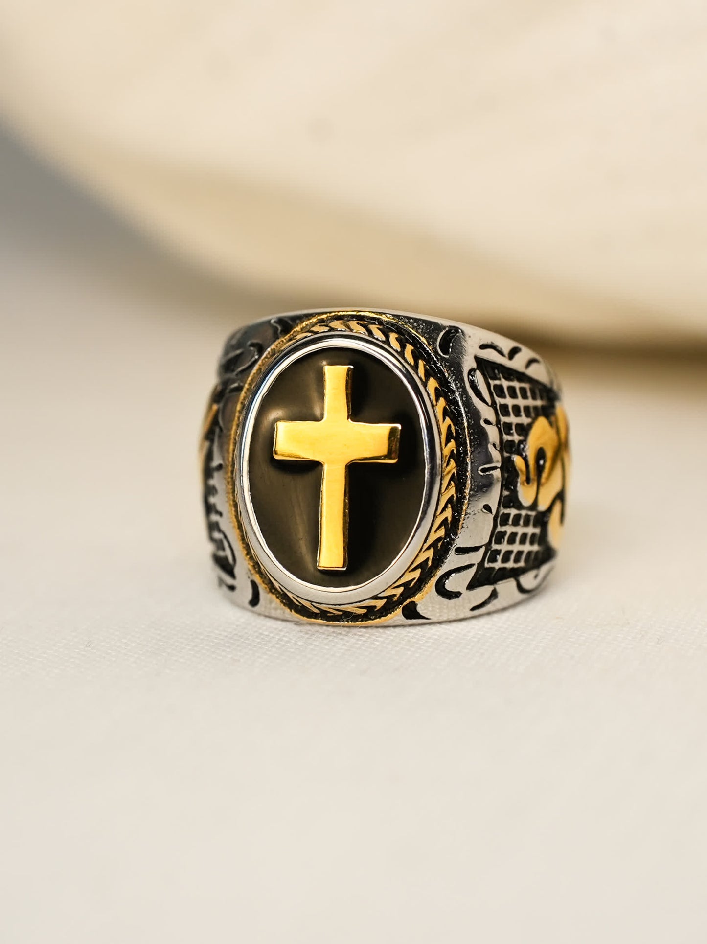 Overhead photo of the Christian signet ring with bold black inlay and 18K gold-plated cross