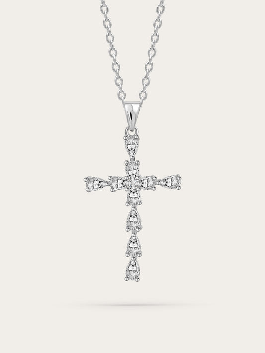 Studio image of the Christian crystal pendant with silver teardrop stones on a soft beige background