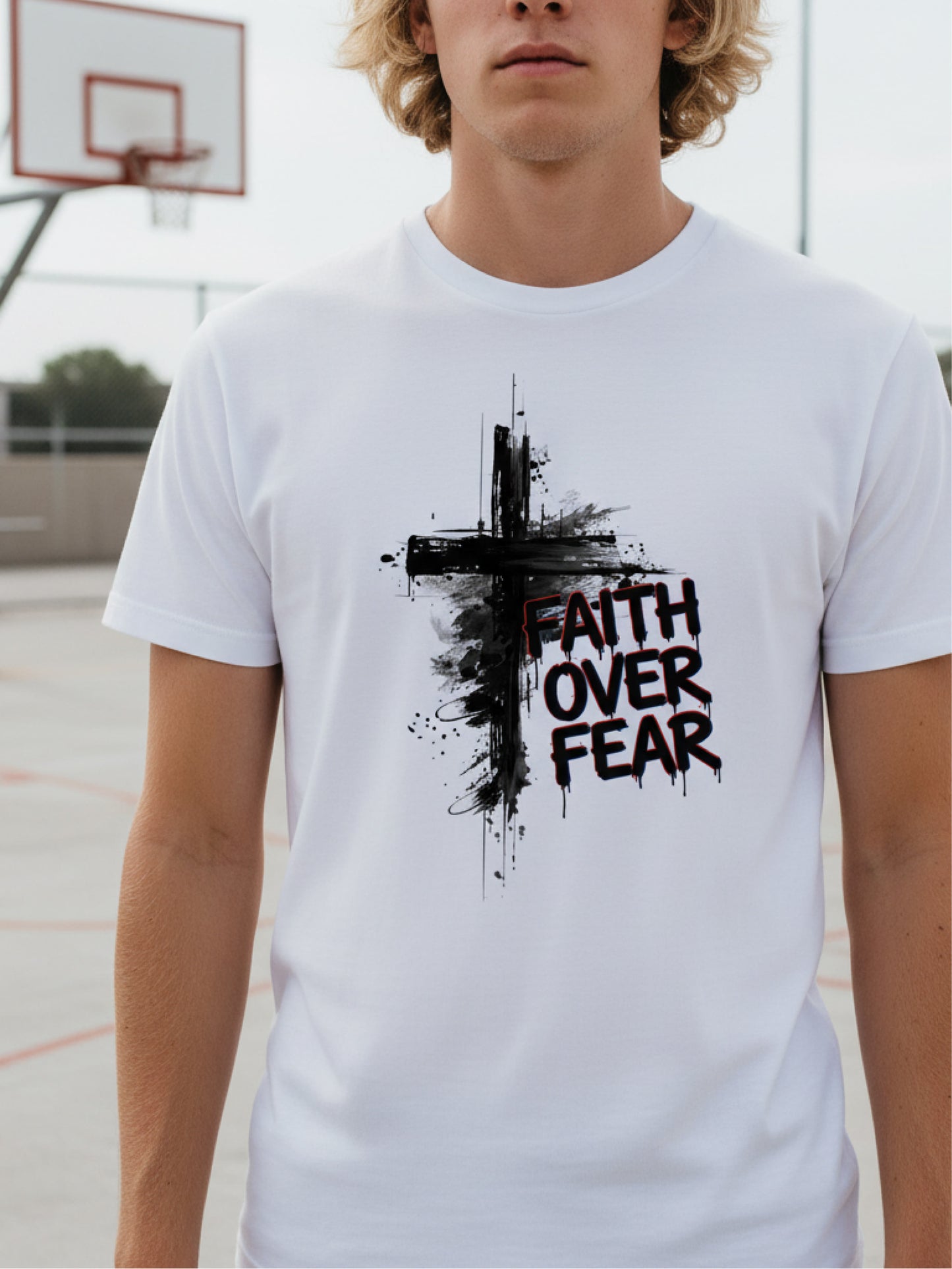 white Faith Over Fear painted cross T-shirt shown close up on a young male model; meaningful bold Christian men’s graphic tee designed for everyday faith.