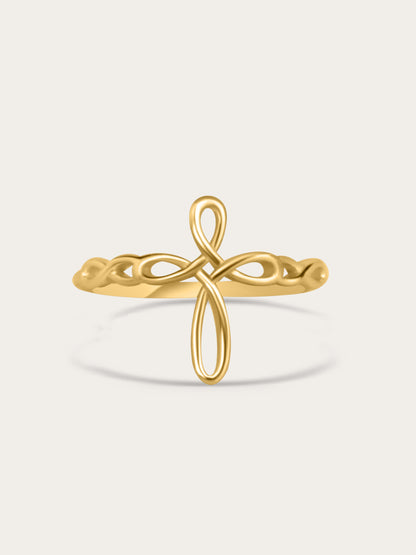 Front-facing studio image of sculptural ribbon-style faith ring in 18K gold plating, centered on light beige background