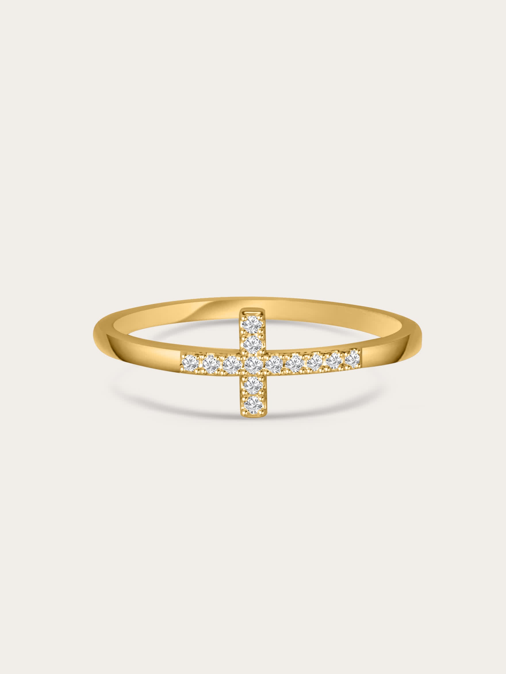 Front-facing image of the Anointed Radiance gold cross ring with pavé cubic zirconia set in a slim 18K gold-plated band