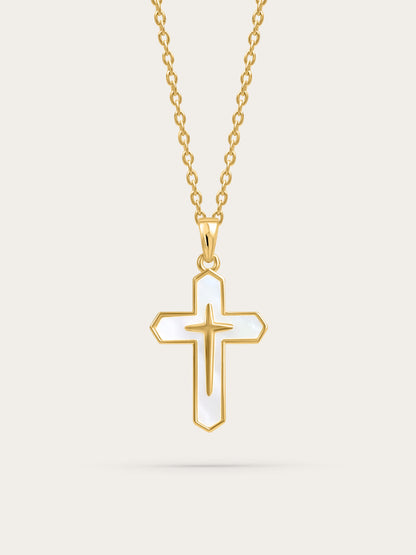 Front-facing product image of a gold cross necklace with white enamel inlay on a light background

