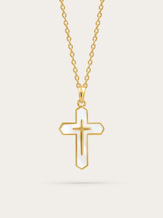Front-facing product image of a gold cross necklace with white enamel inlay on a light background

