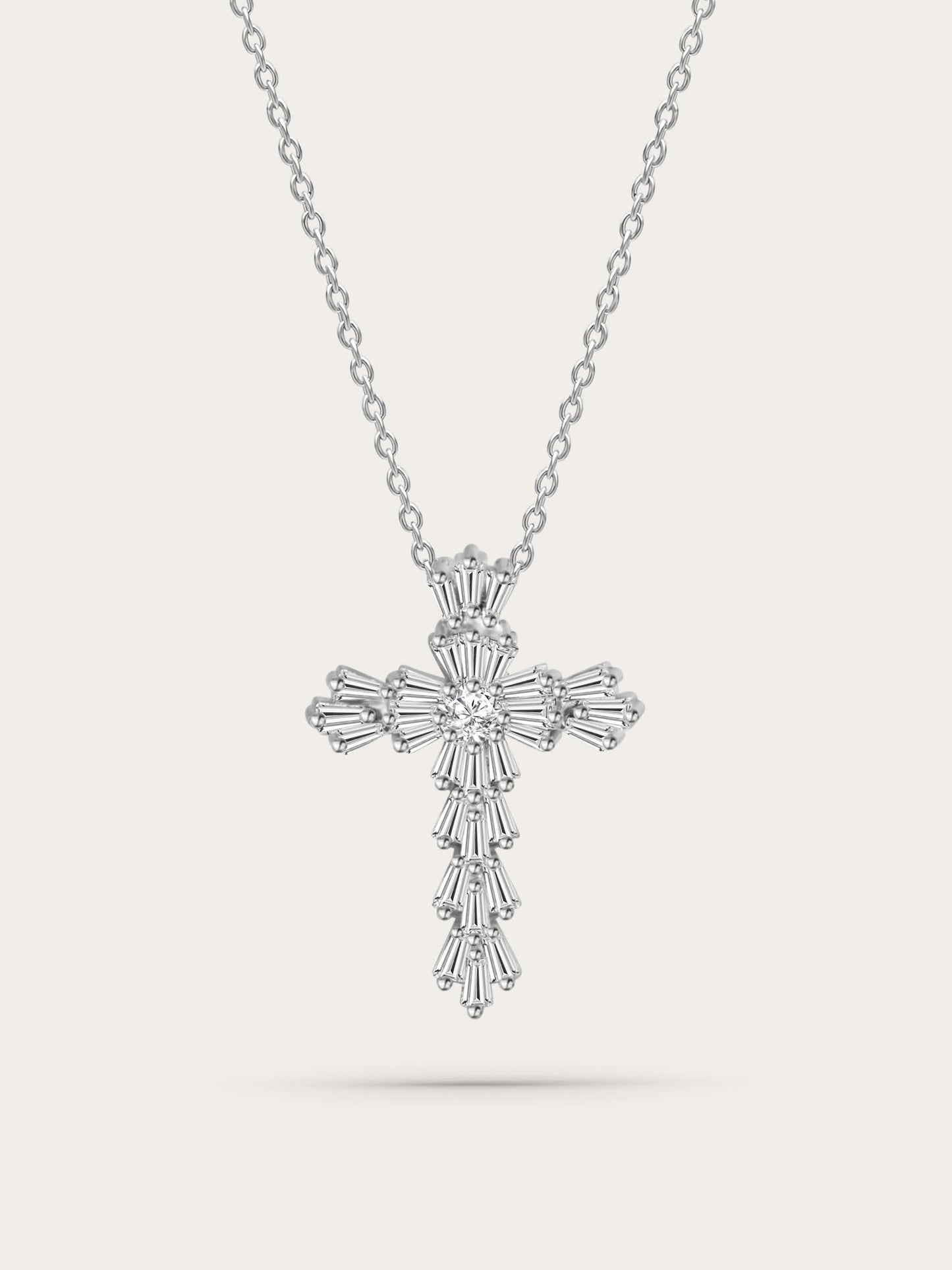 Front-facing studio image: Elegant silver gothic cross necklace featuring layered baguette-cut zircons, suspended on a polished chain against a neutral background