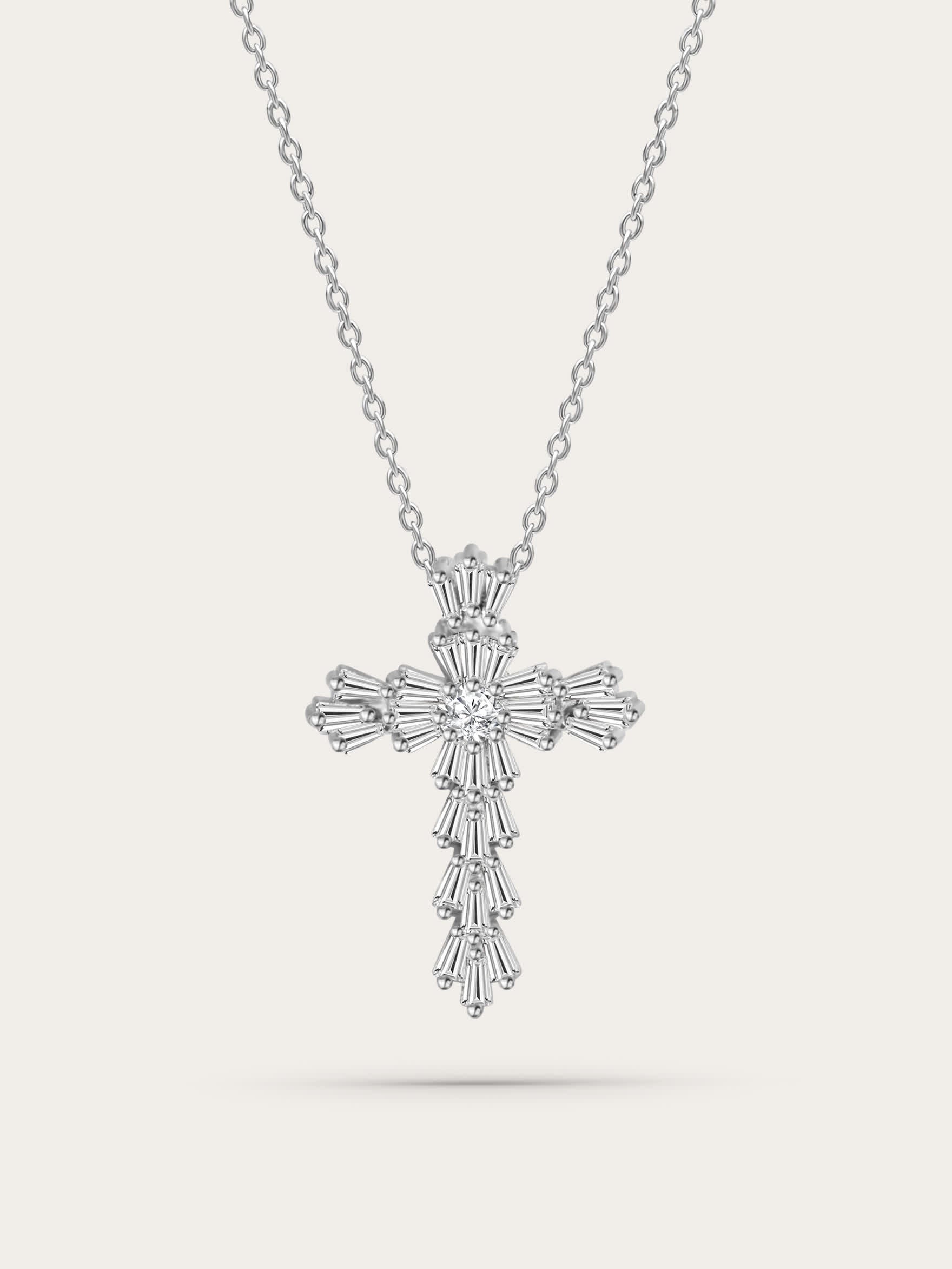 Front-facing studio image: Elegant silver gothic cross necklace featuring layered baguette-cut zircons, suspended on a polished chain against a neutral background