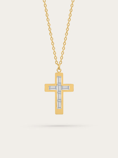 Gold cross necklace with baguette-cut zircon stones on neutral background