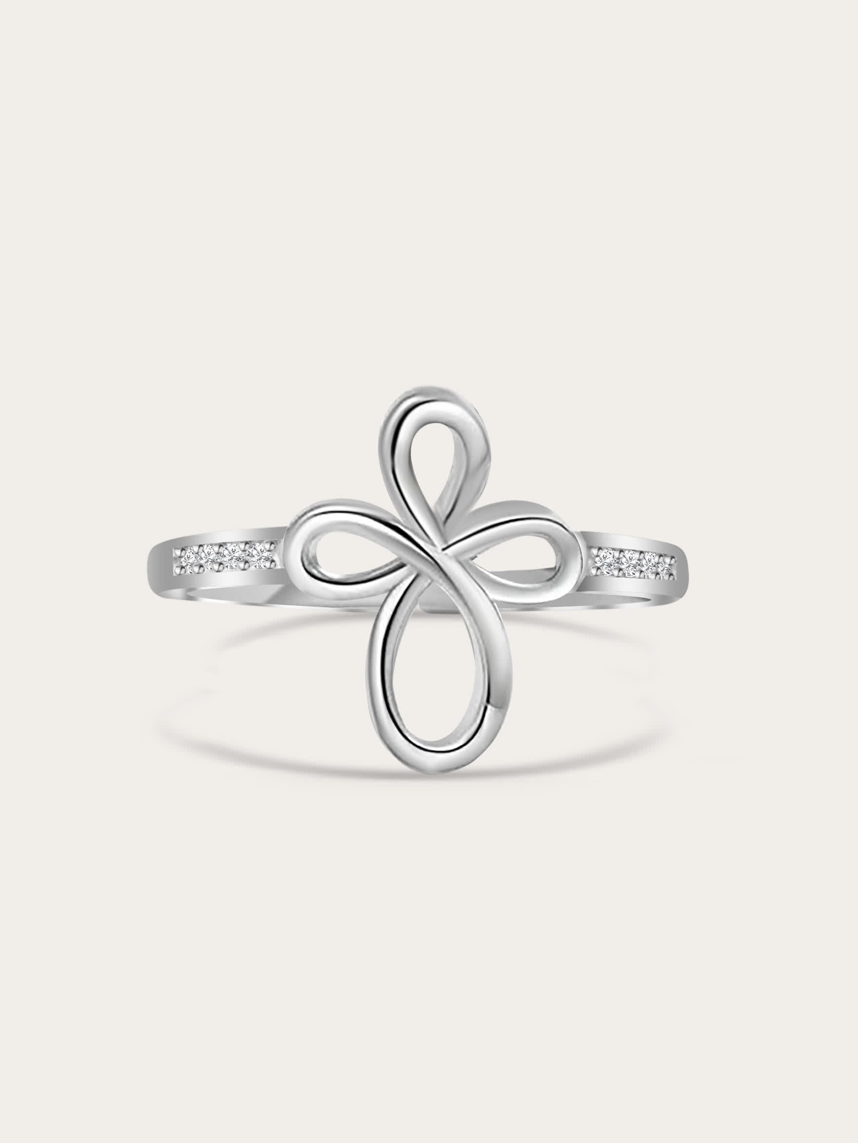 Front-facing studio shot of Covenant Bloom Silver Cross Ring showing heart-shaped petal cross design with white zircons on a neutral background