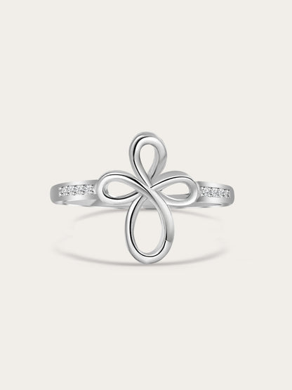 Front-facing studio shot of Covenant Bloom Silver Cross Ring showing heart-shaped petal cross design with white zircons on a neutral background