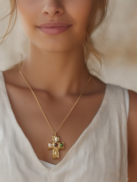 Model wearing multicolor gemstone gold cross necklace with sculpted texture and vibrant stones by Lumencross brand