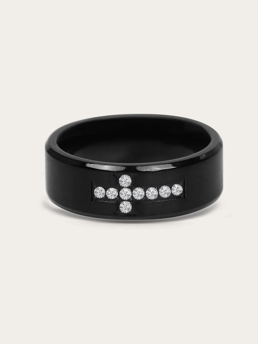 Front-facing product image of Creed Noir Black Cross Ring on white background, showcasing the pavé crystal cross design centered on a black polished band.