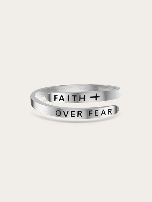 Adjustable sterling silver faith over fear wrap ring engraved with bold black lettering