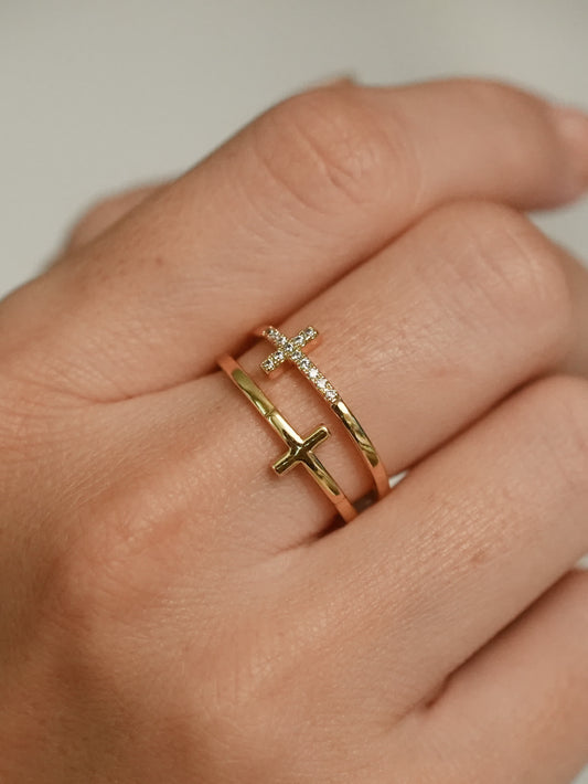 Close-up of the Faith Shield Double Cross Ring worn on a woman's finger, showcasing the elegant open band and dual cross design
