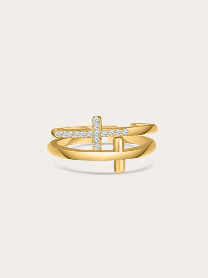 Front-facing studio photo of the Faith Shield Double Cross Gold Ring with pavé zircon cross and smooth gold cross, set against a soft beige background