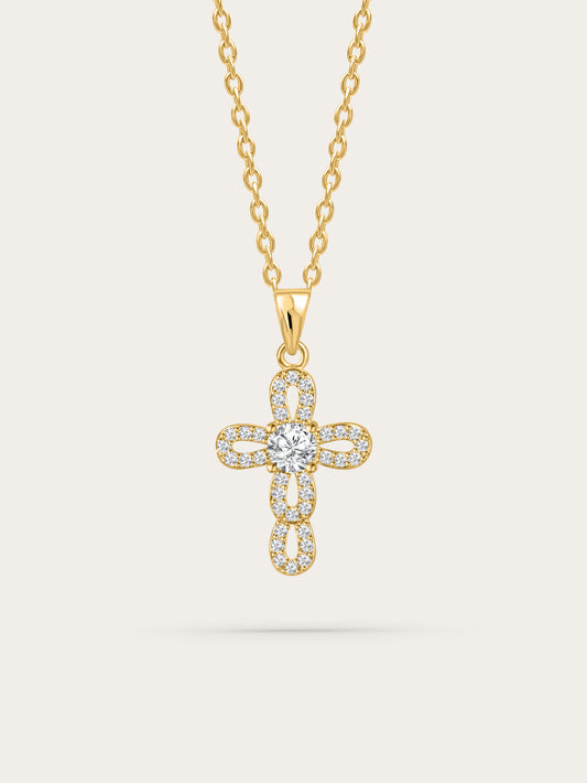 Front view of gold loop cross necklace on white background with radiant center crystal