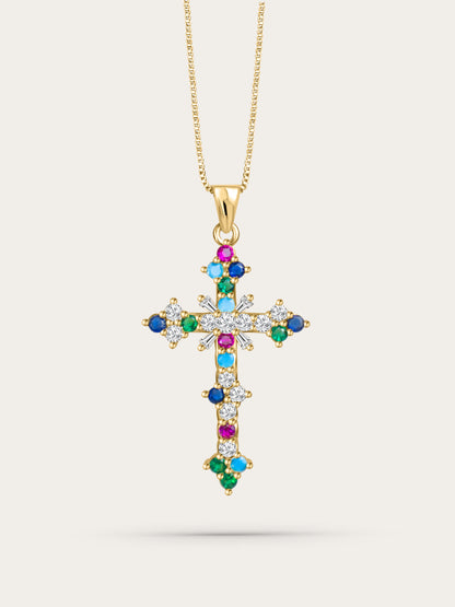 Front-facing studio photo of the colorful crystal cross pendant on light beige background, featuring multicolor zircon stones and gold chain