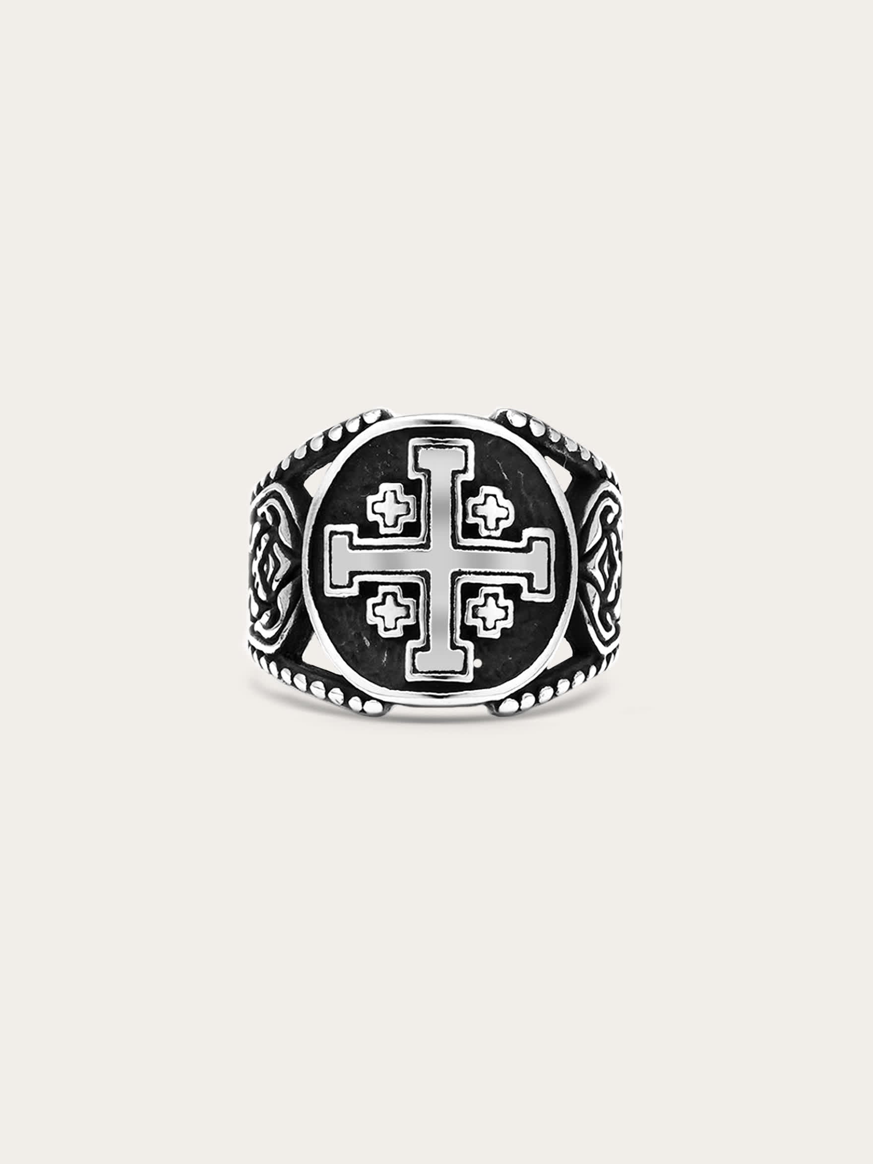 Front-facing image of a titanium steel Jerusalem cross ring with engraved medieval symbols and antiqued finish