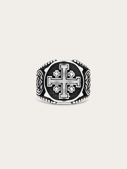 Front-facing image of a titanium steel Jerusalem cross ring with engraved medieval symbols and antiqued finish