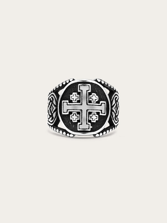 Front-facing image of a titanium steel Jerusalem cross ring with engraved medieval symbols and antiqued finish
