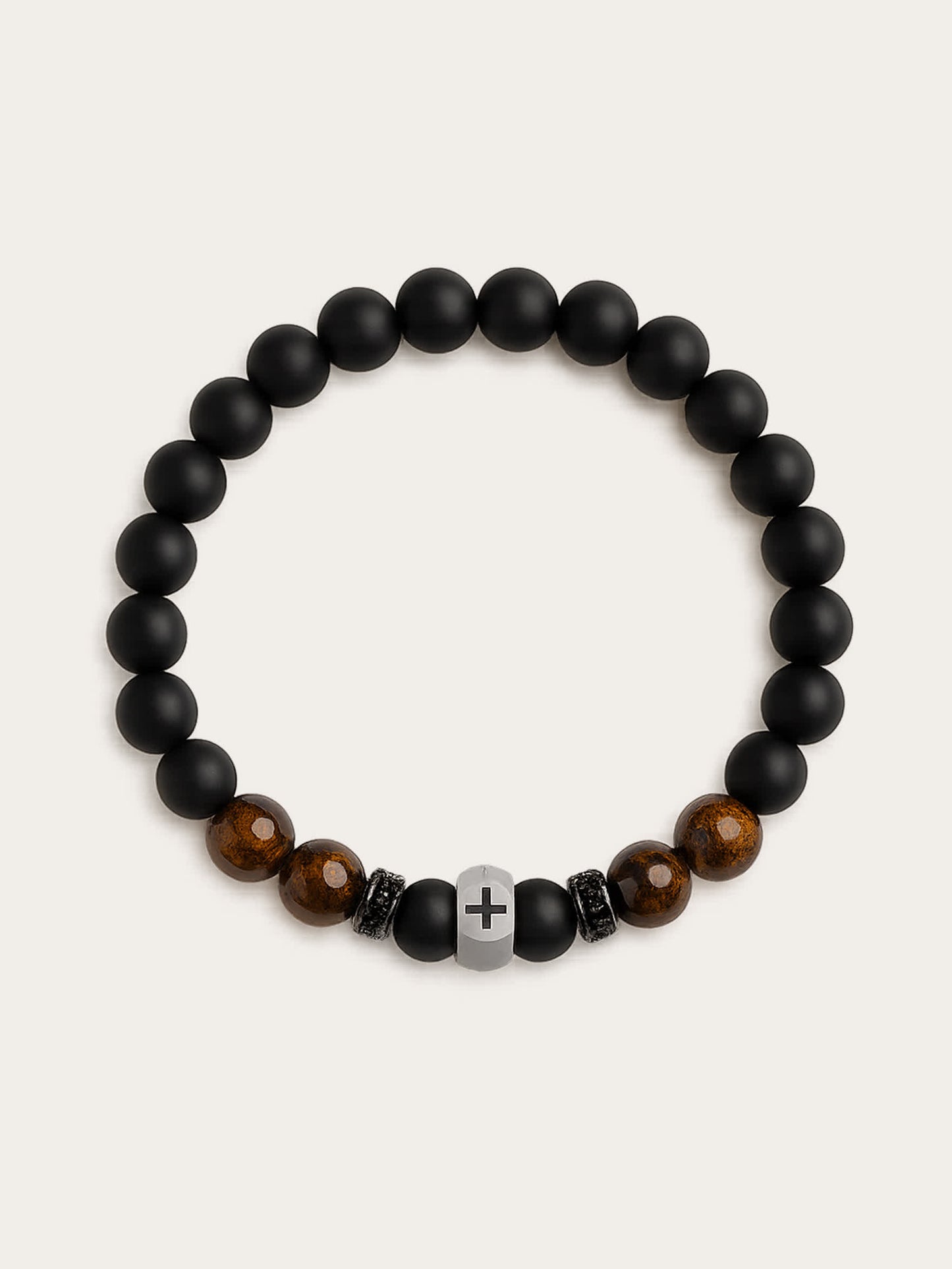 Front-facing studio photo of the Lion's Peace Men's Religious Bracelet made of black obsidian and tiger’s eye beads with stainless steel cross charm, displayed on a clean cream background.