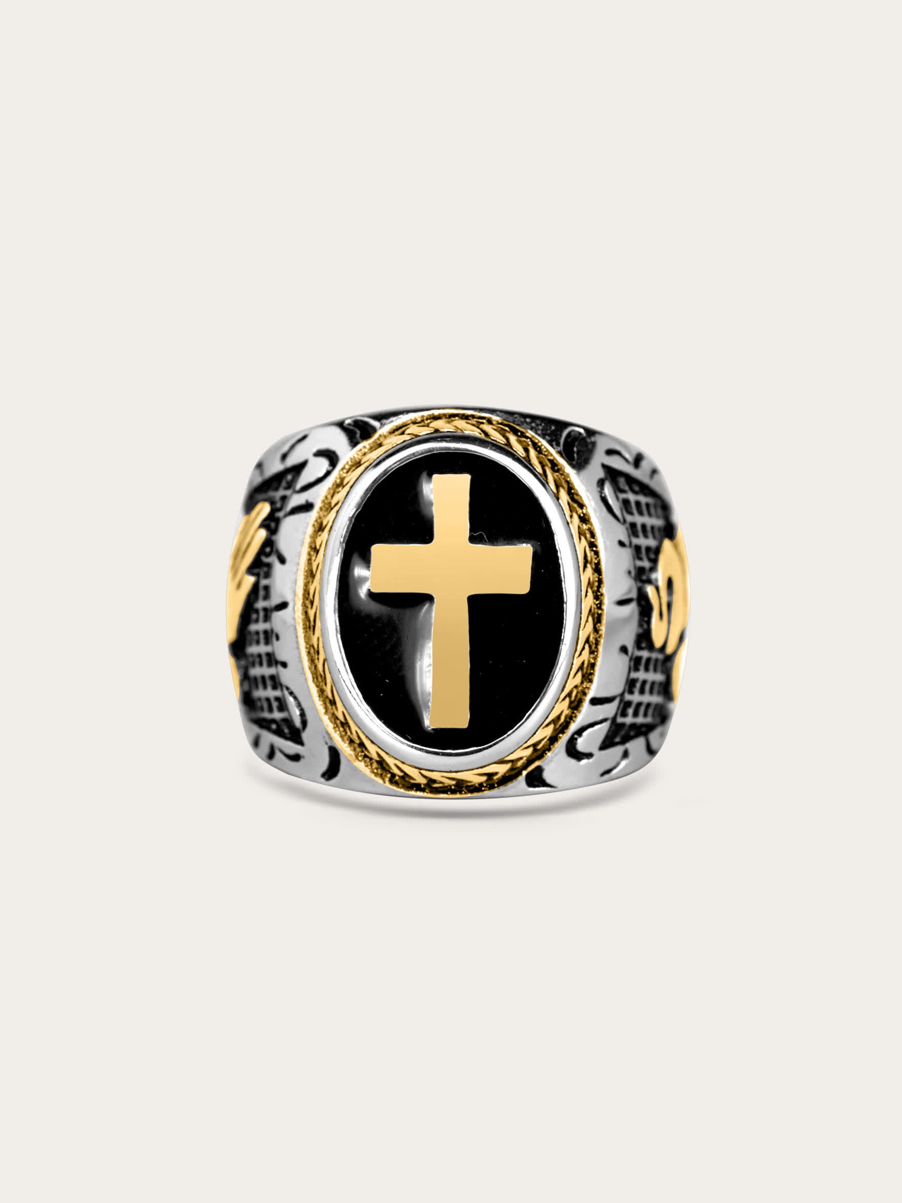 Front-facing view of the Lionheart Sacred Emblem Ring with gold cross and black enamel center on stainless steel