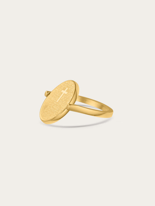 Side angle showing the engraved cross side of the two-sided gold-plated Christian ring