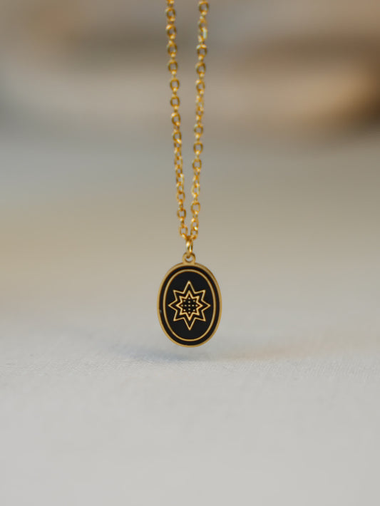 Christian star necklace resting on beige surface with soft natural lighting