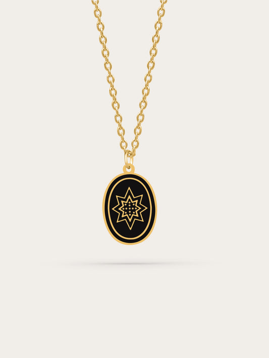 Radiant 18K gold Bethlehem star necklace with black enamel pendant on white background