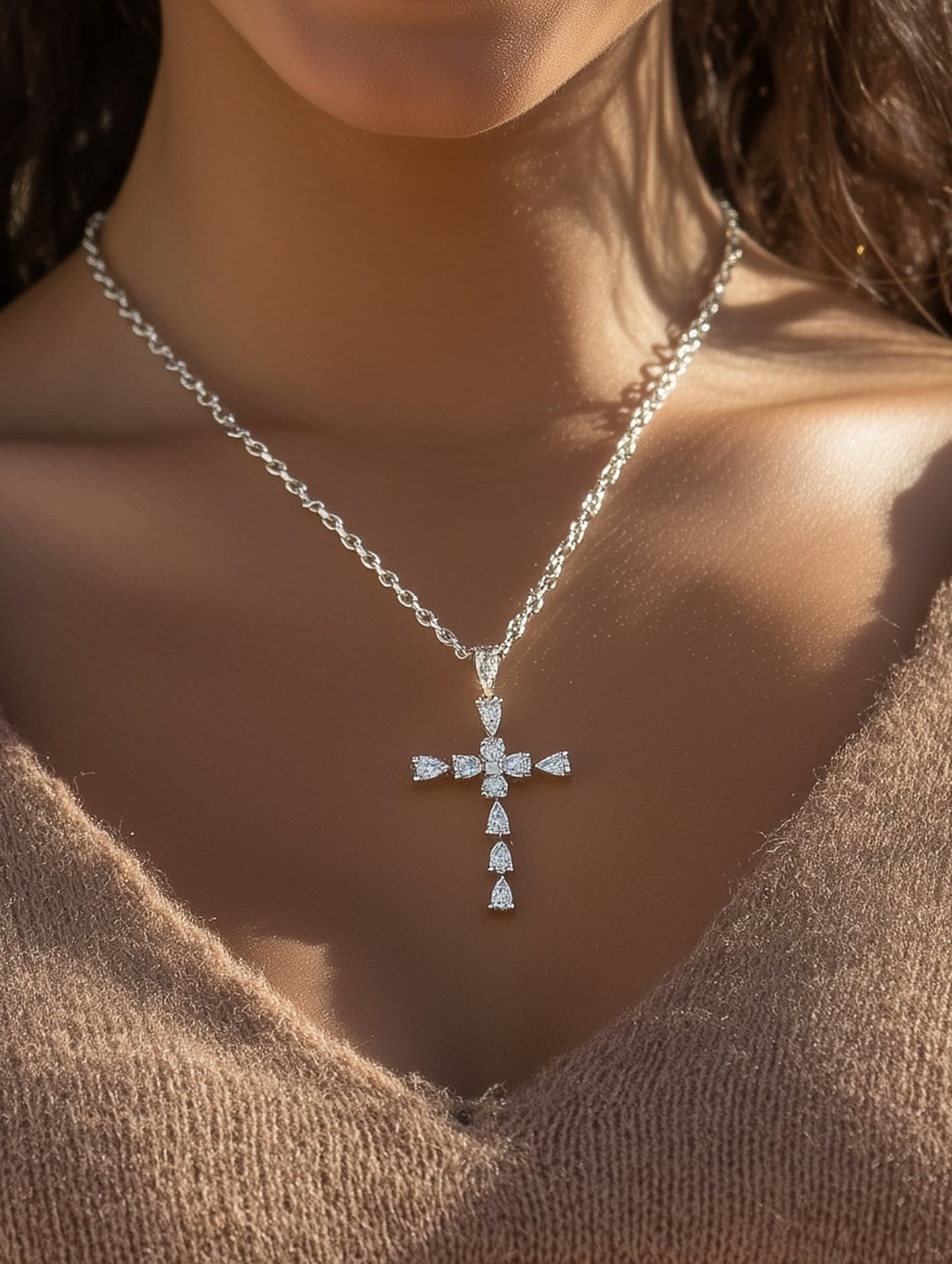 Woman wearing the Christian crystal cross necklace, highlighting its elegant placement and shimmer