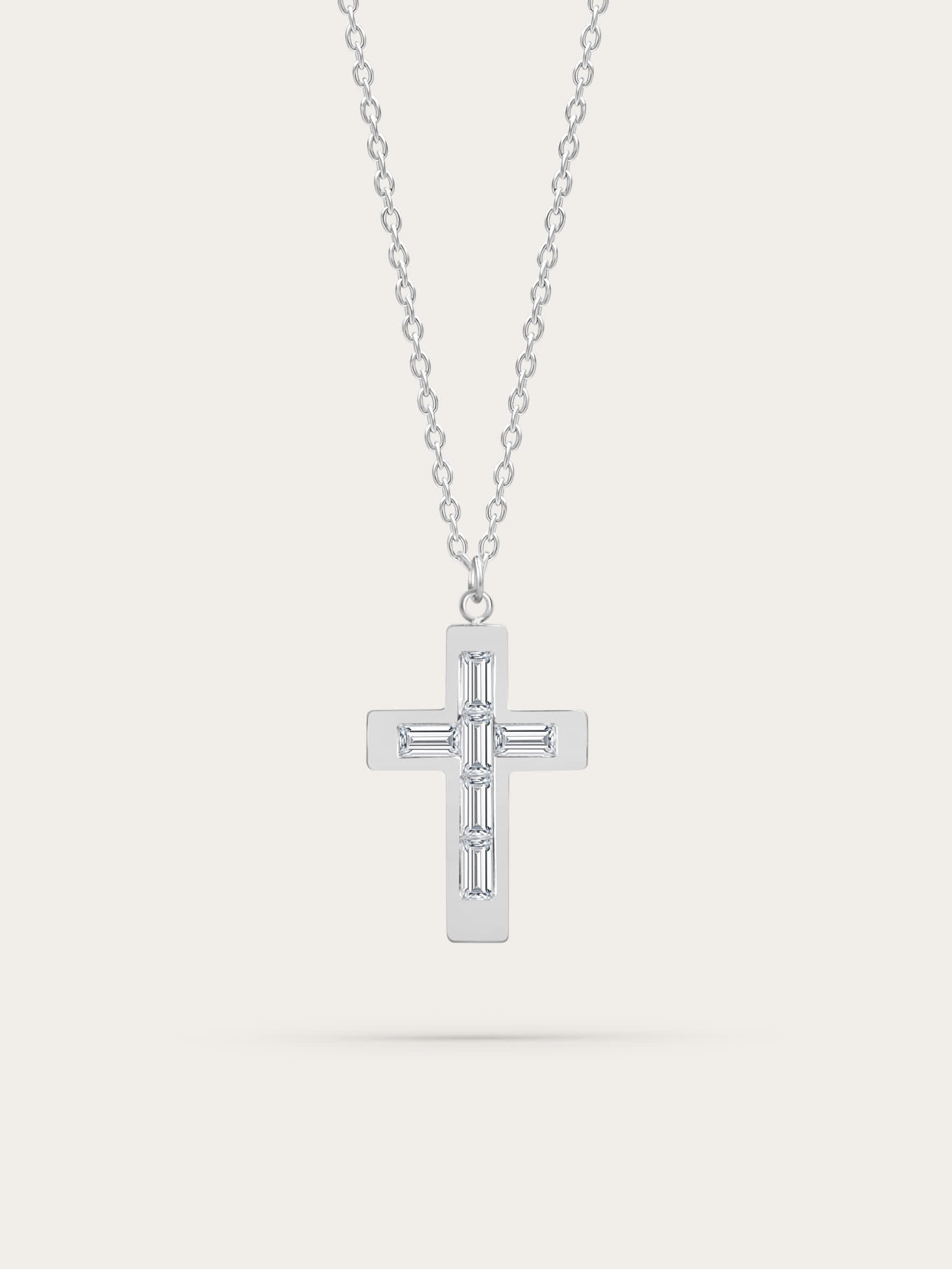 Silver stainless steel cross necklace with baguette-cut zircons on light background