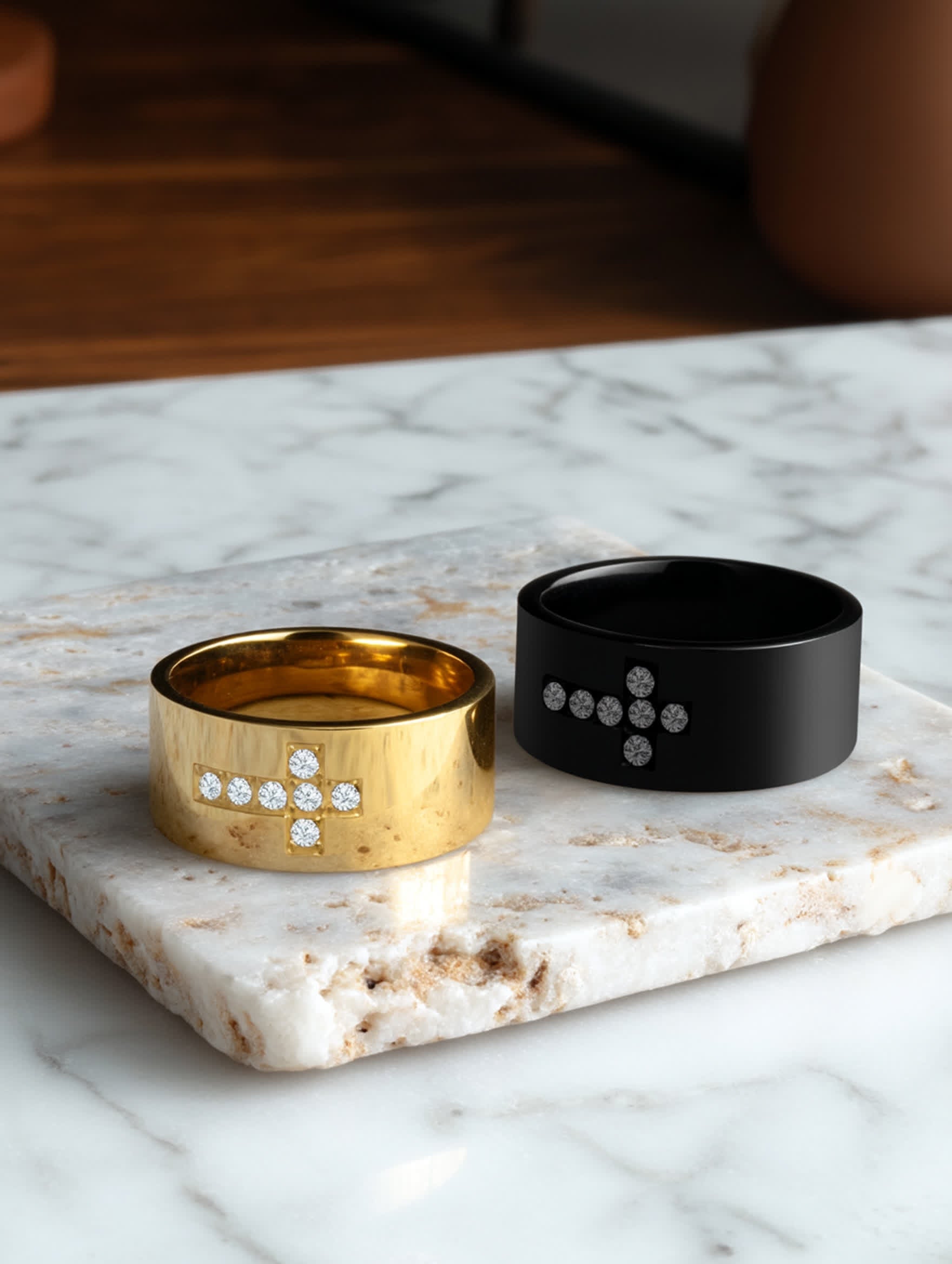 Lifestyle Flat Lay – Marble Surface
Matching gold and black cross rings with crystal accents placed on white marble slab, elegant product flat lay