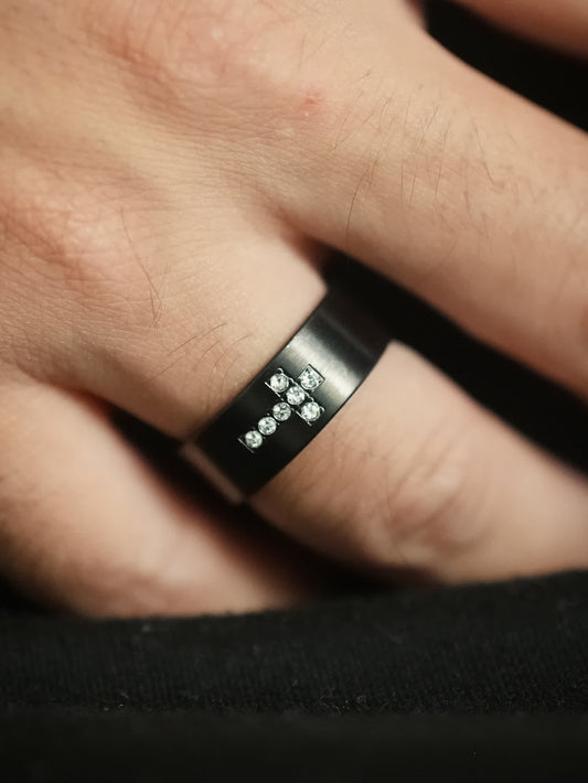 Close-up – Black Ring on Hand
Men’s black stainless steel ring with cubic zirconia cross design worn on finger, side angle view