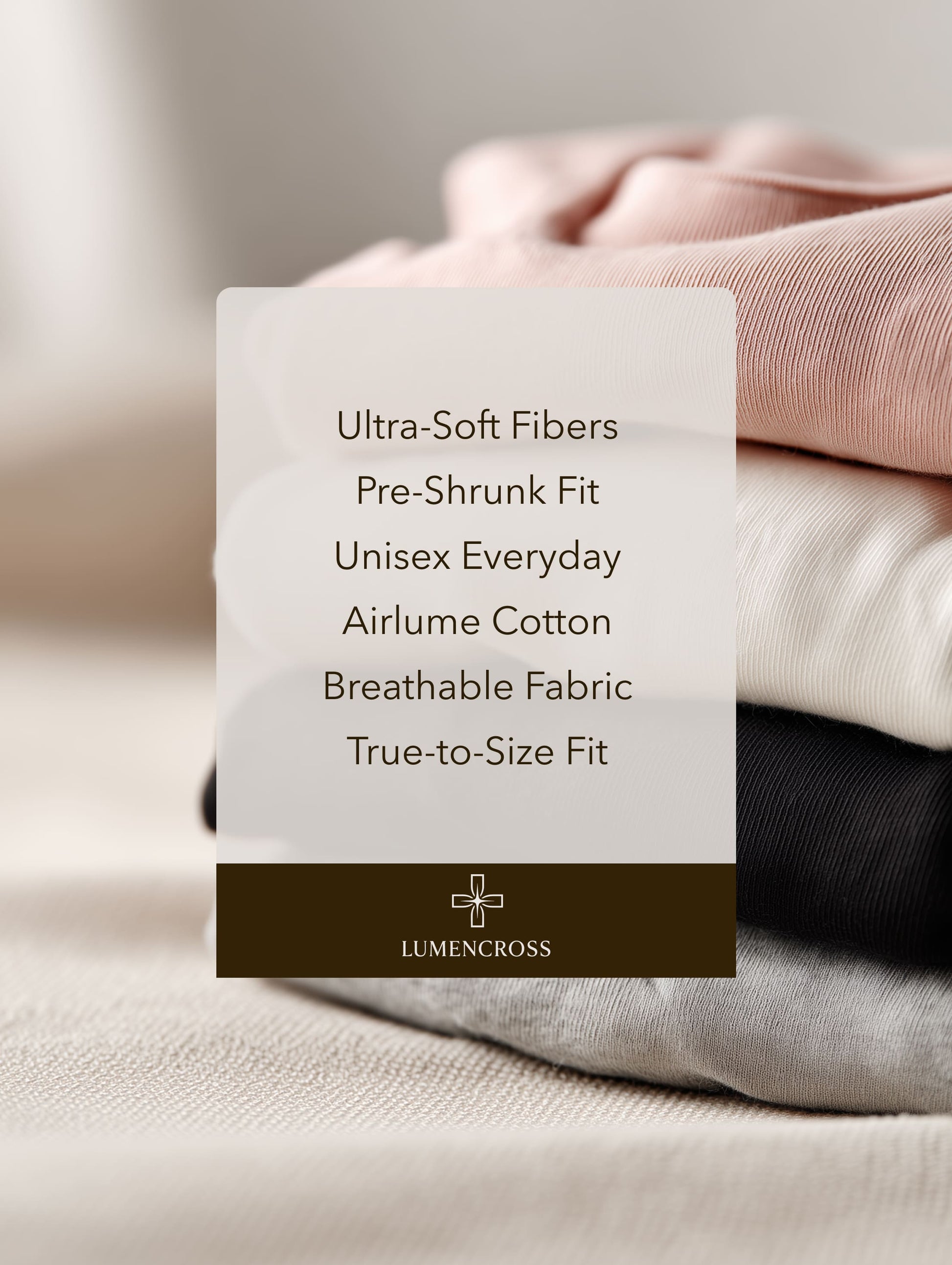 Stack of folded clothes with Lumencross label detailing fabric properties. Christian apparel brand