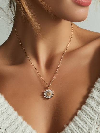 Close-up of woman wearing crystal flower necklace with deep gold and clear zircon design