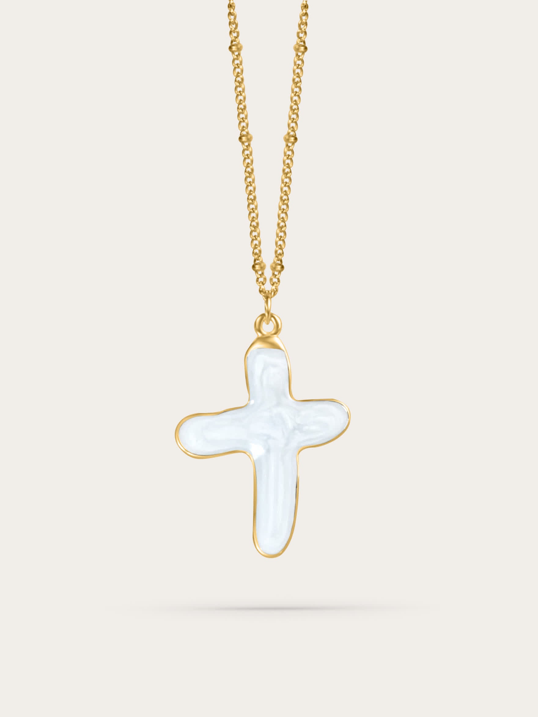 White shell cross pendant necklace in 14k gold vermeil, suspended mid-air on a neutral background – elegant Christian jewelry design.